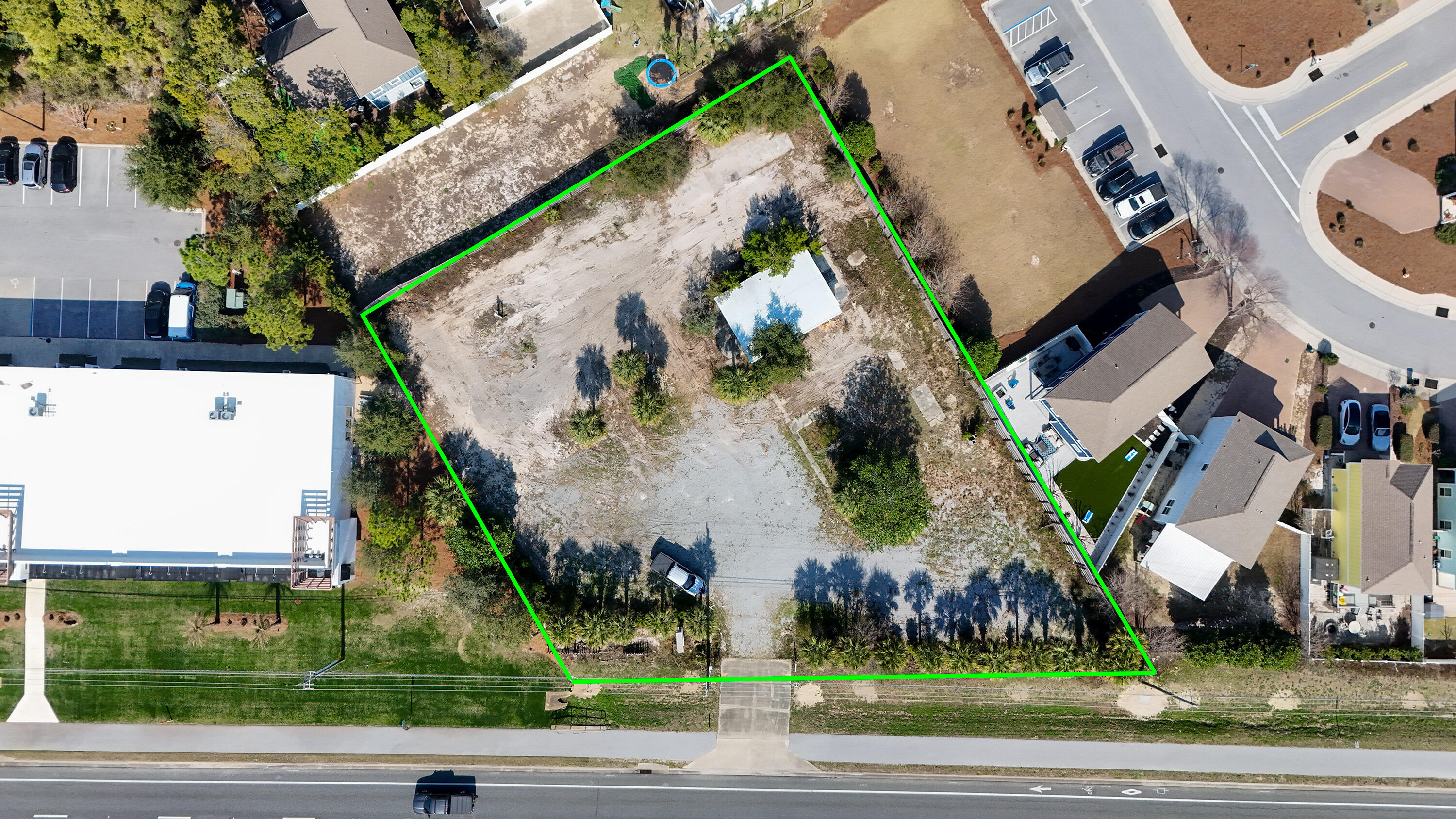 13161 Highway 98 Inlet Beach, FL 32461 - Photo 7 of 25 an aerial view of a residential apartment building with a yard and parking space