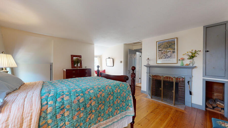 654 Pleasant Point Road Cushing, ME 04563 - Photo 45 of 81 Primary Bedroom w/ Fireplace