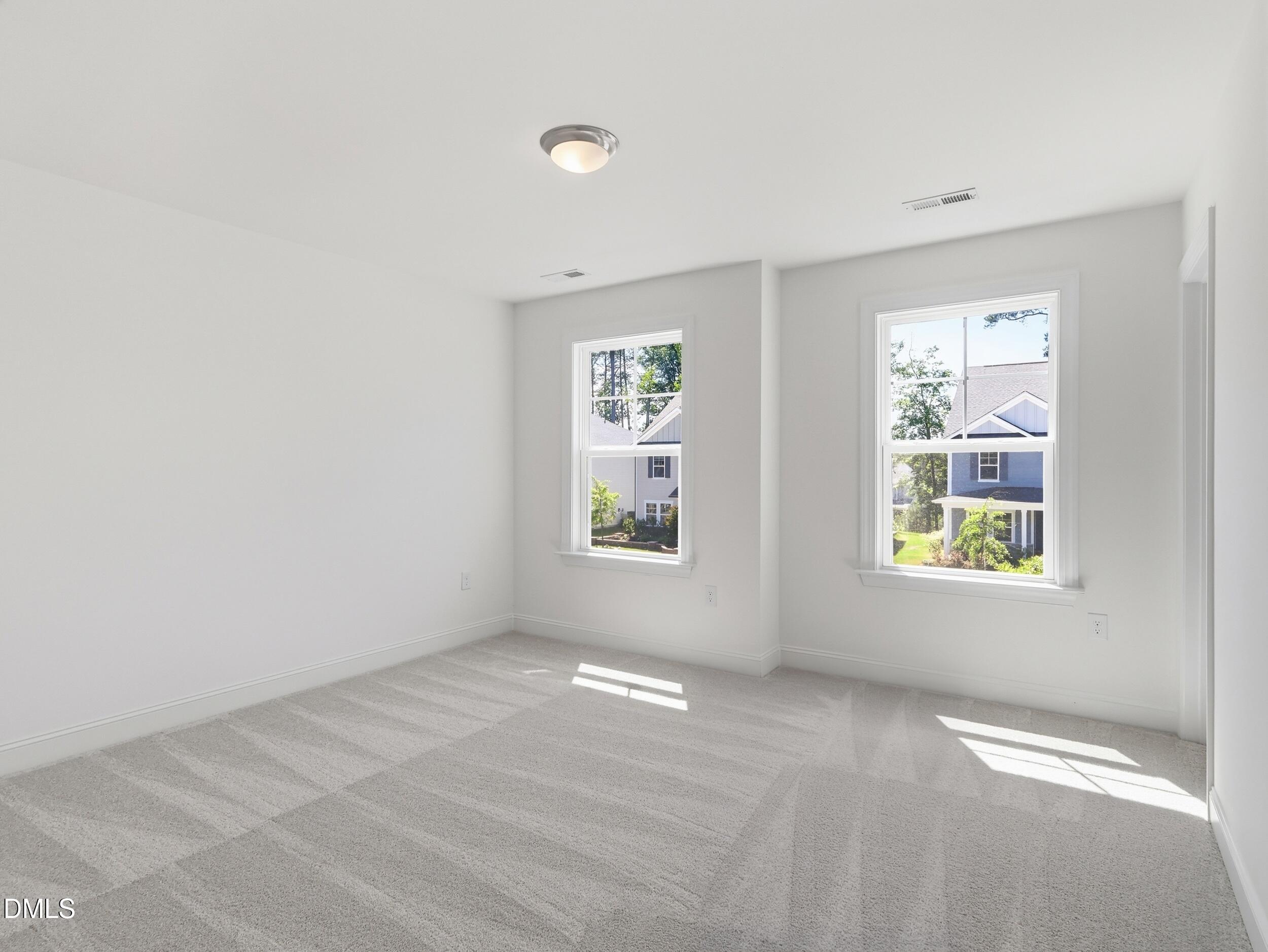 2709 Womble Ridge Drive New Hill, NC 27562 - Photo 40 of 60 a view of an empty room with a window