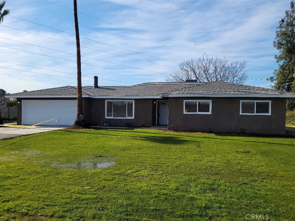 18070 Road 26 Madera, CA 93638 - Photo 1 of 1 a front view of a house with a garden
