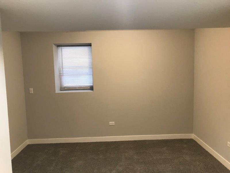 3210 South May Street, Unit B Chicago, IL 60608 - Photo 12 of 12 an empty room with a window