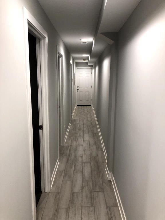 3210 South May Street, Unit B Chicago, IL 60608 - Photo 8 of 12 a view of a hallway with wooden floor