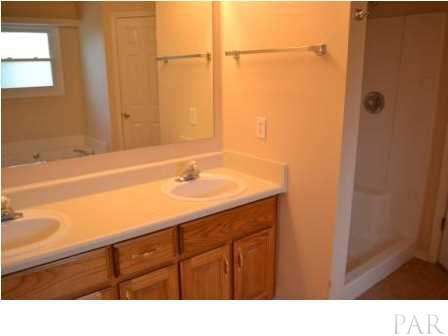 5836 Pebble Ridge Drive Milton, FL 32583 - Photo 8 of 14 Master Bath showing double vanities and separate shower