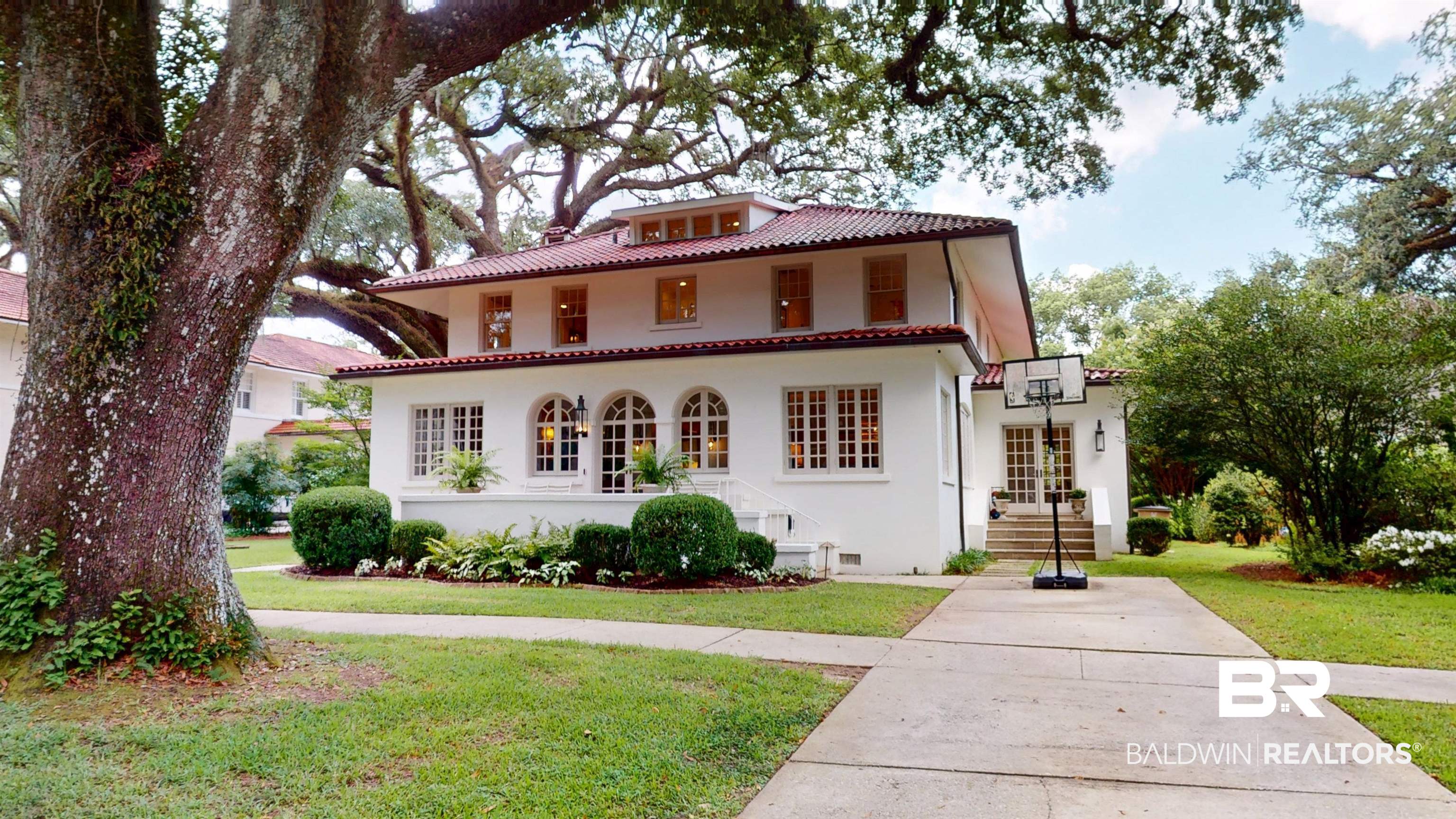 211 Lanier Avenue Mobile, AL 36607 - Photo 54 of 73 Mediterranean / spanish home with a tile roof, stucco siding, and a front lawn