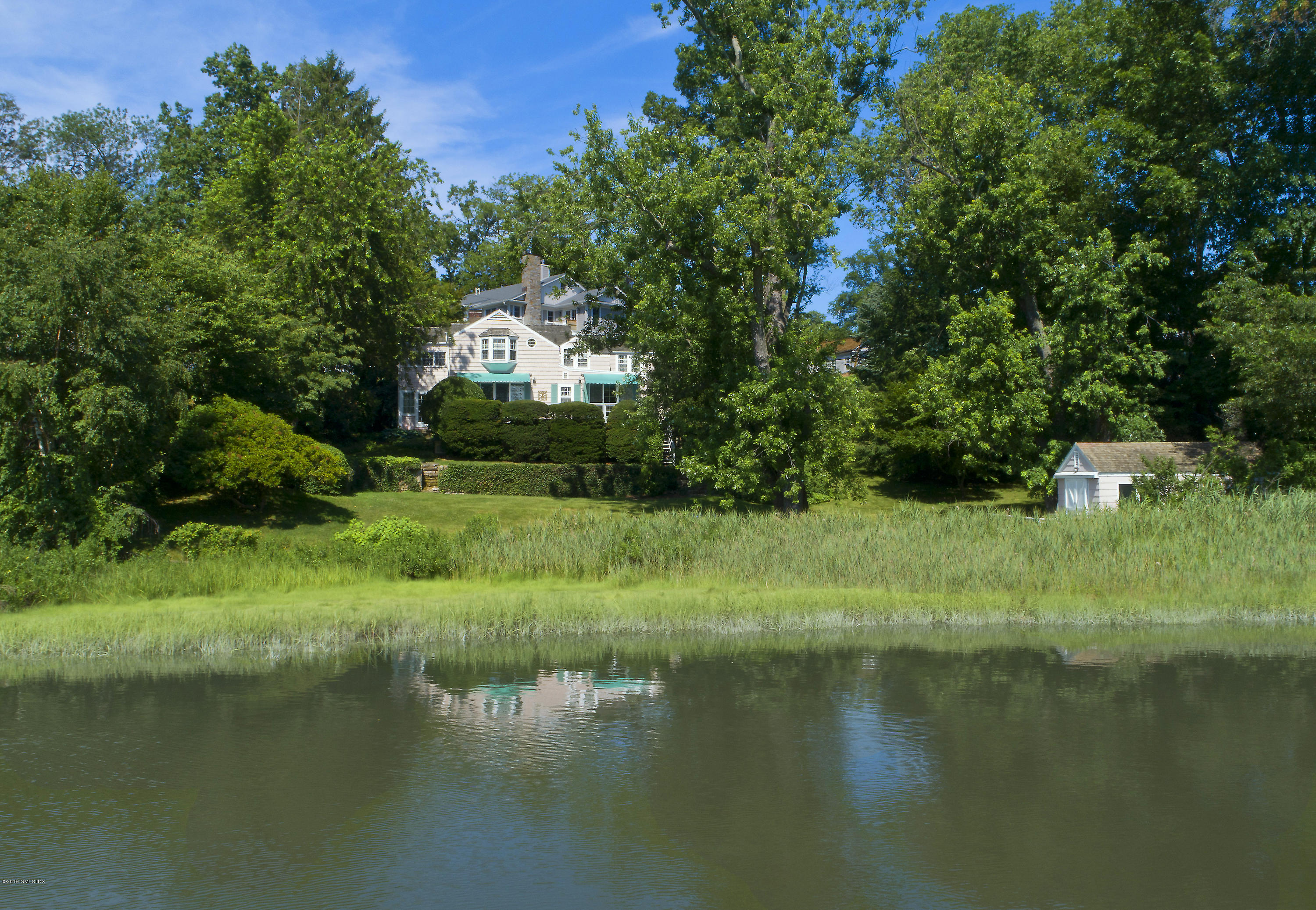 3 Perkley Lane Riverside, CT 06878 - Photo 3 of 29 a view of a garden with a lake
