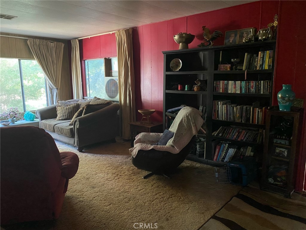 11775 State Highway Red Bluff, CA 96080 - Photo 17 of 23 a living room with furniture and a bookshelf