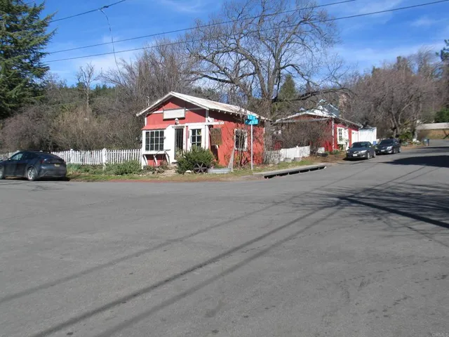a street view with a car parked on the side of road