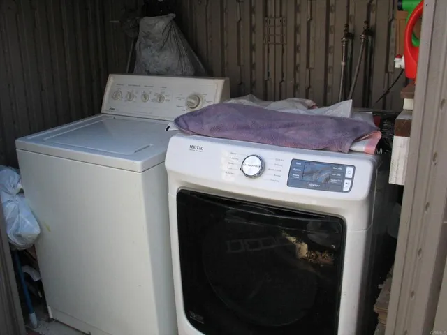 a bedroom with bed and a window