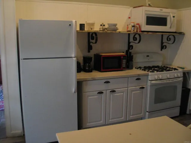 a bathroom with a toilet and a shower curtain
