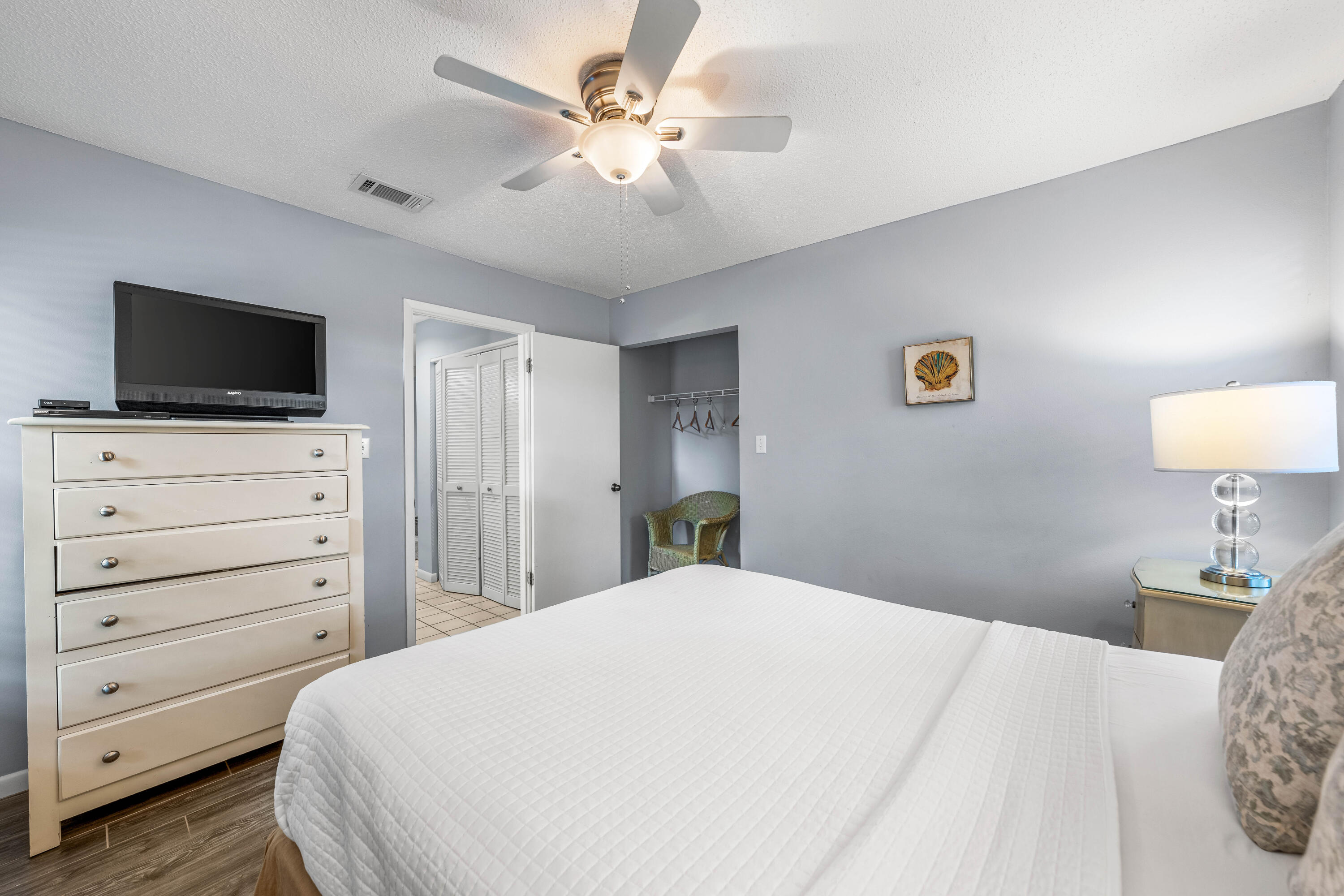 9815 Highway 98, Unit 127 Miramar Beach, FL 32550 - Photo 22 of 39 a bedroom with a bed and a flat screen tv
