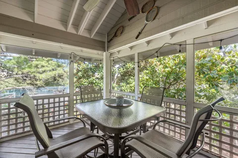 a view of a city from a dining room with large windows