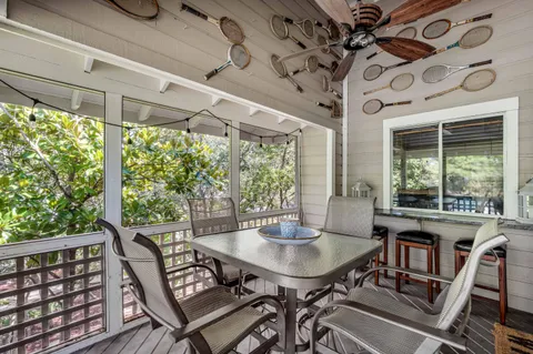 a view of a patio with a table and chairs