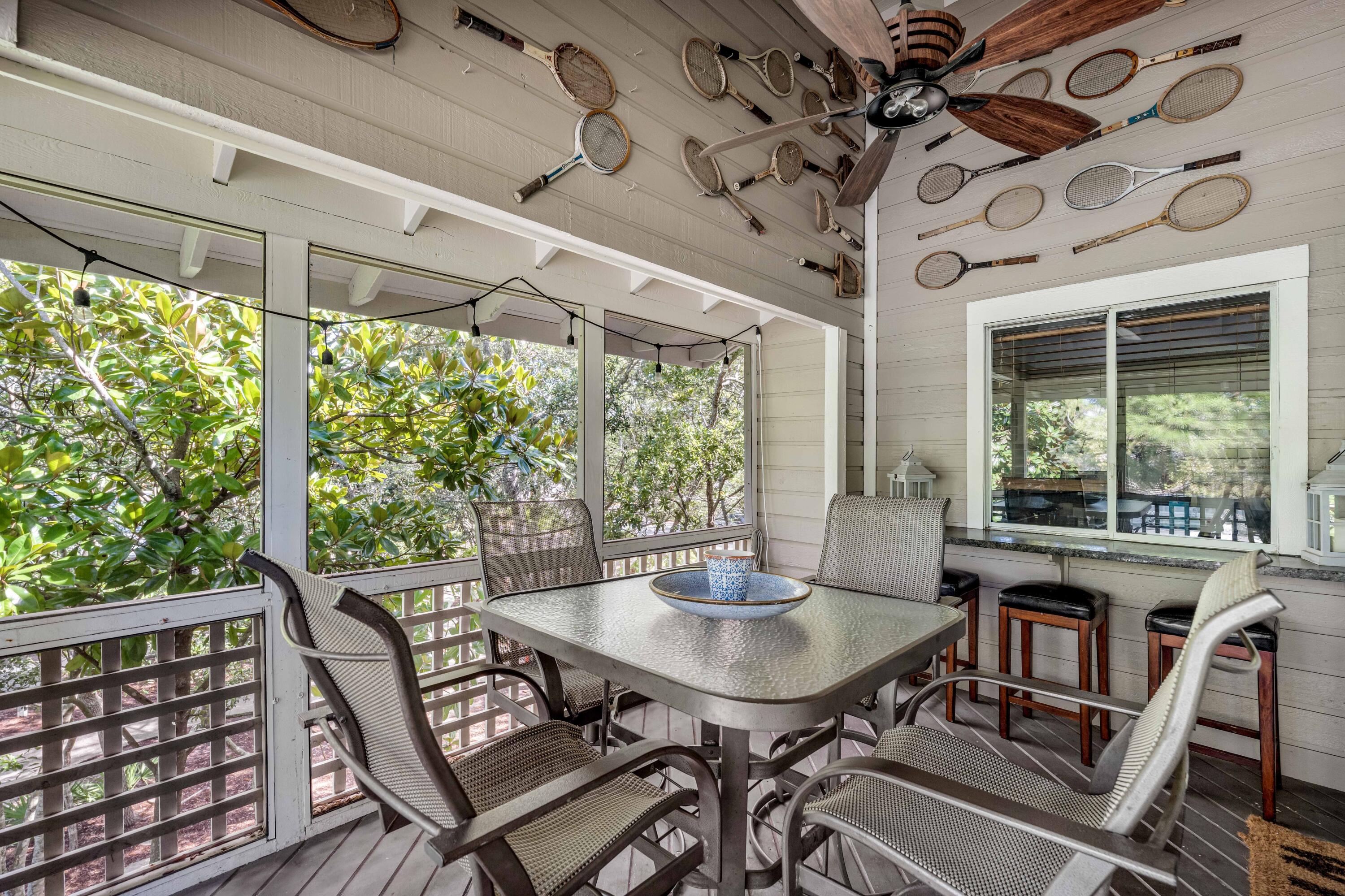 9815 Highway 98, Unit 127 Miramar Beach, FL 32550 - Photo 30 of 39 a view of a patio with a table and chairs
