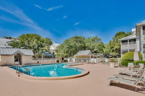 a view of a swimming pool with a patio