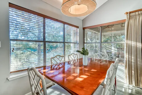 a dining room with a table and chairs