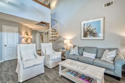 a living room with furniture and a painting