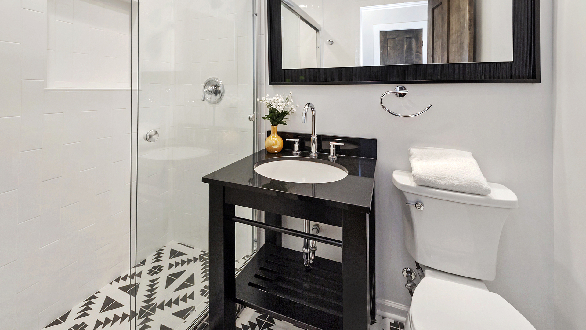 1321 West Addison Street, Unit 2A Chicago, IL 60613 - Photo 8 of 17 a bathroom with a toilet a sink and mirror