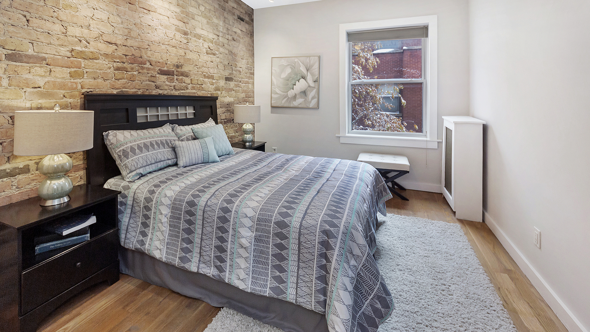 1321 West Addison Street, Unit 2A Chicago, IL 60613 - Photo 10 of 17 a bed room with a bed and a window