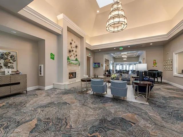 a view of a livingroom with furniture and windows