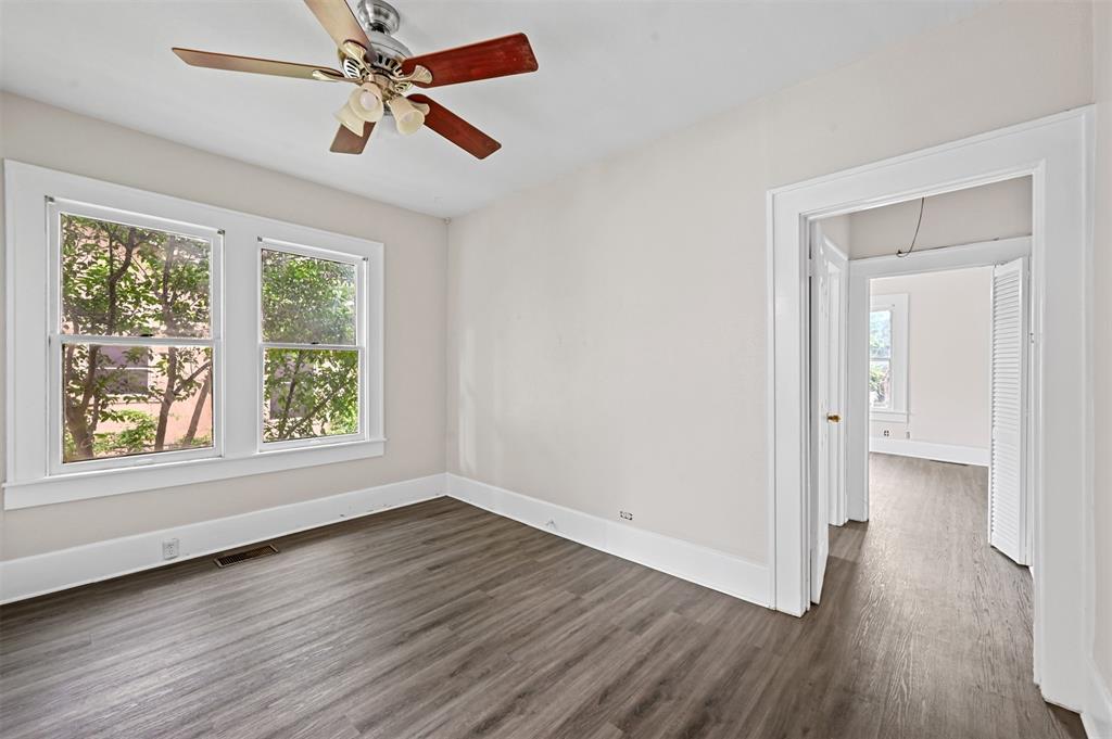 520 Brooks Avenue Dallas, TX 75208 - Photo 13 of 22 wooden floor in an empty room with a window