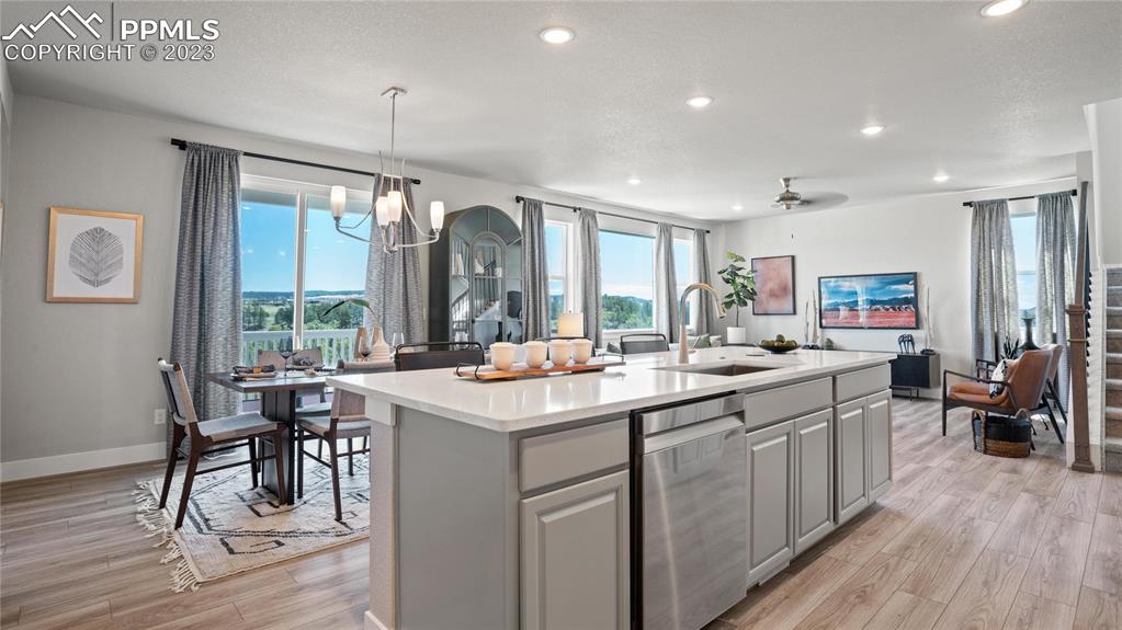 2174 Coyote Mint Drive Monument, CO 80132 - Photo 28 of 50 a kitchen with sink cabinets and wooden floor