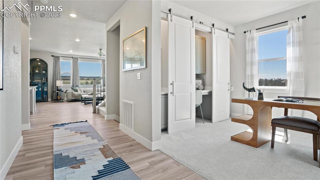2174 Coyote Mint Drive Monument, CO 80132 - Photo 37 of 50 a bathroom with a glass shower door and a bathtub