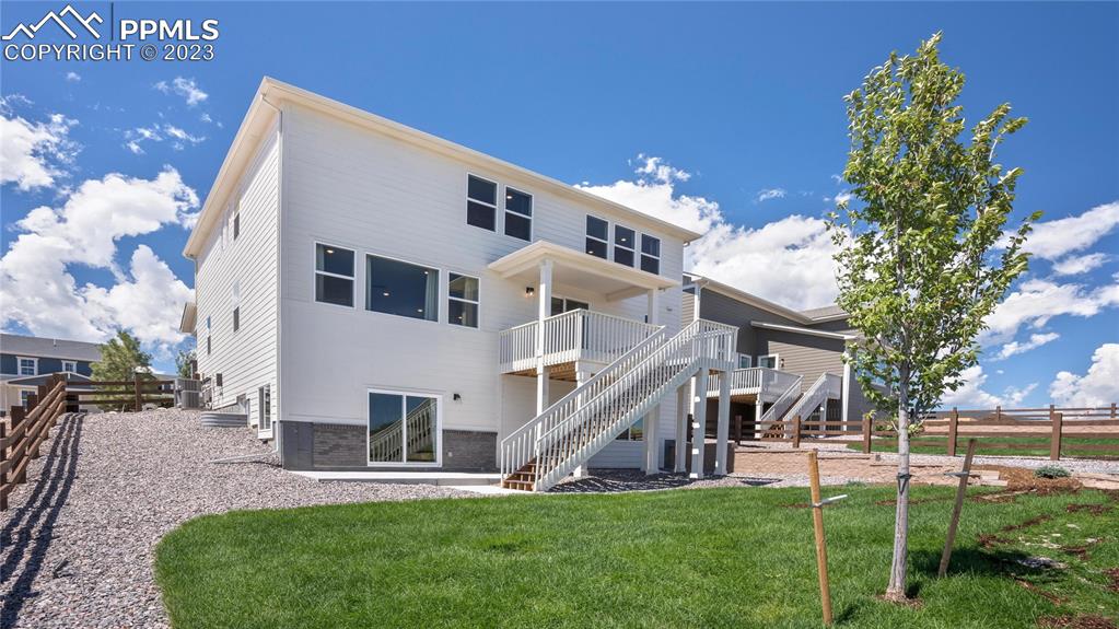 2174 Coyote Mint Drive Monument, CO 80132 - Photo 49 of 50 a view of a house with a yard porch and sitting area
