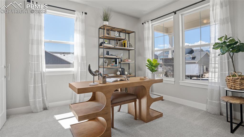 2174 Coyote Mint Drive Monument, CO 80132 - Photo 5 of 50 a dining room with furniture and window