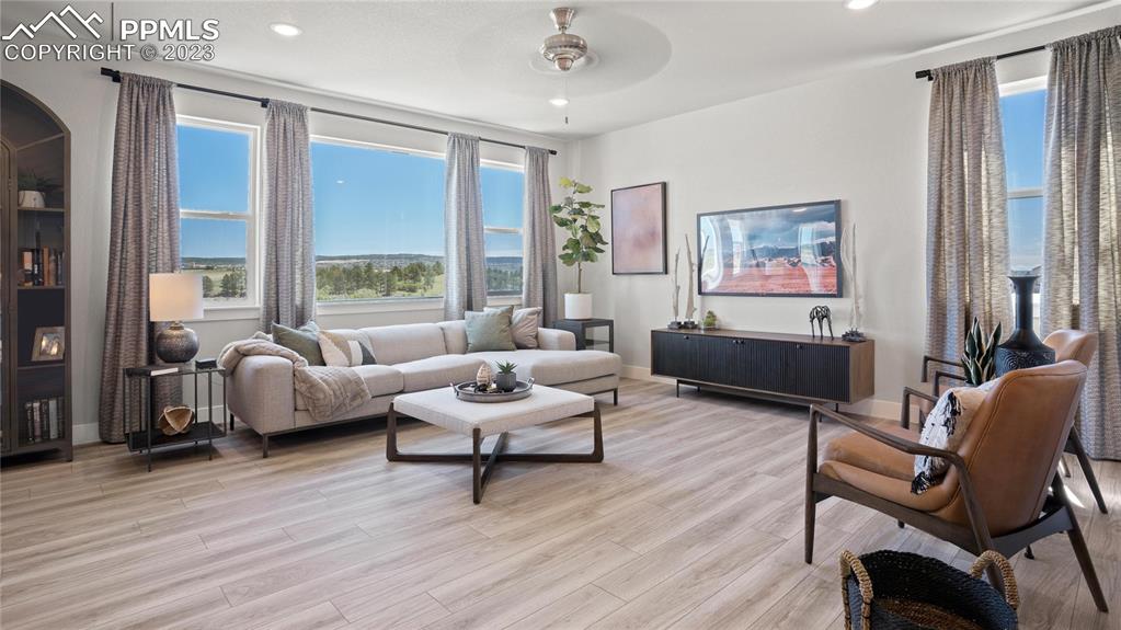 2174 Coyote Mint Drive Monument, CO 80132 - Photo 6 of 50 a living room with furniture and a large window