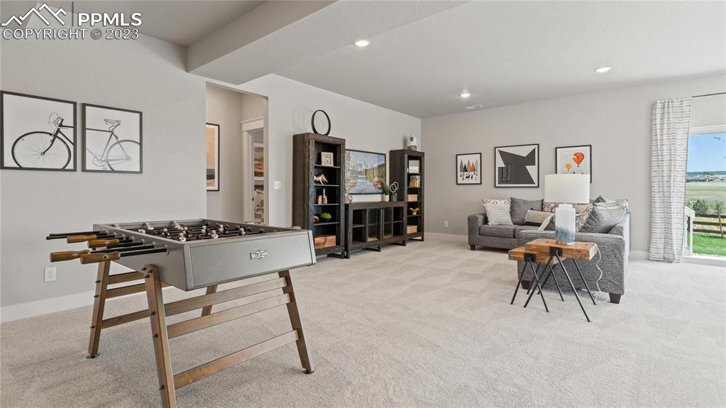 2174 Coyote Mint Drive Monument, CO 80132 - Photo 10 of 50 a living room with furniture a dining table and a window