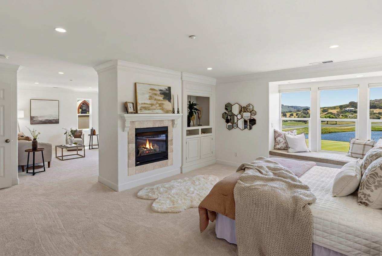 302 Pasadera Drive Monterey, CA 93940 - Photo 13 of 40 a bed room with a bed and a fireplace
