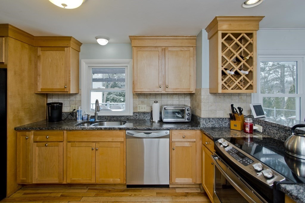 128 Birch Road Longmeadow, MA 01106 - Photo 13 of 39 a kitchen with stainless steel appliances granite countertop a stove a sink and a microwave