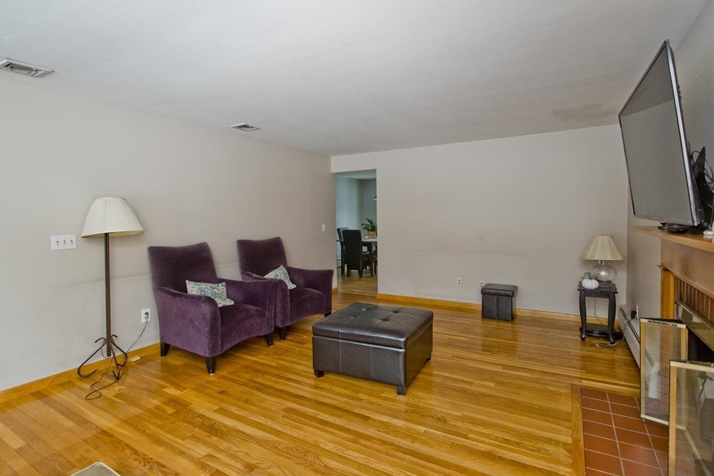 128 Birch Road Longmeadow, MA 01106 - Photo 19 of 39 a living room with furniture and a flat screen tv