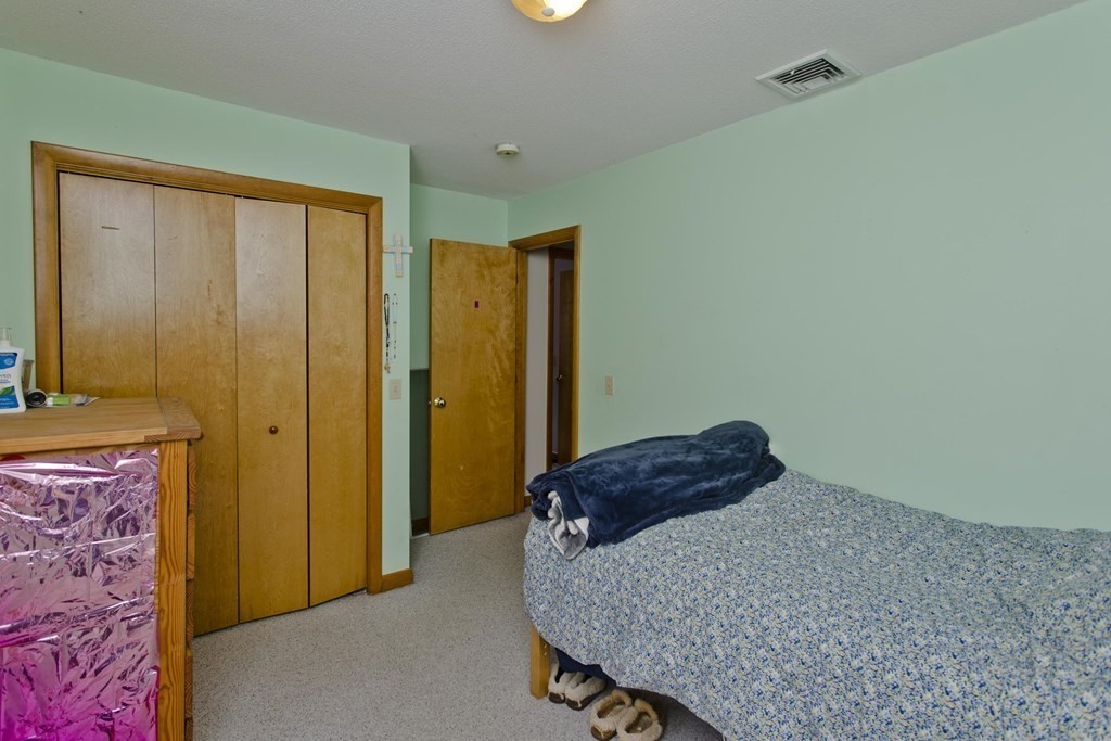 128 Birch Road Longmeadow, MA 01106 - Photo 29 of 39 a bedroom with a bed and a dresser