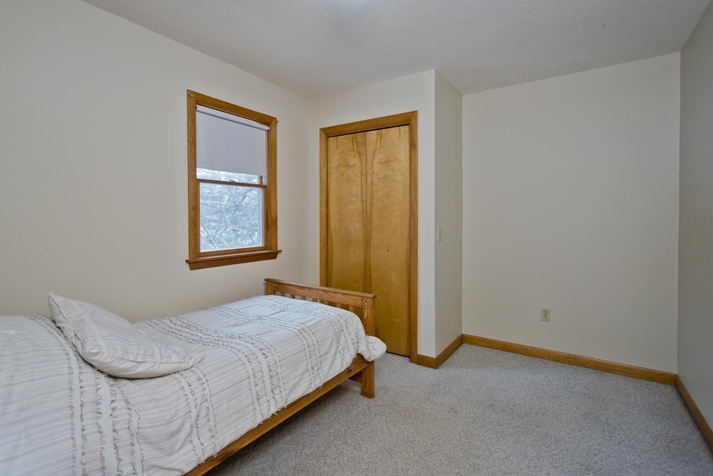 128 Birch Road Longmeadow, MA 01106 - Photo 30 of 39 a bedroom with a bed and a window