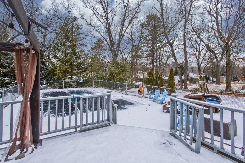 128 Birch Road Longmeadow, MA 01106 - Photo 5 of 39 a view of a chair and tables in the backyard
