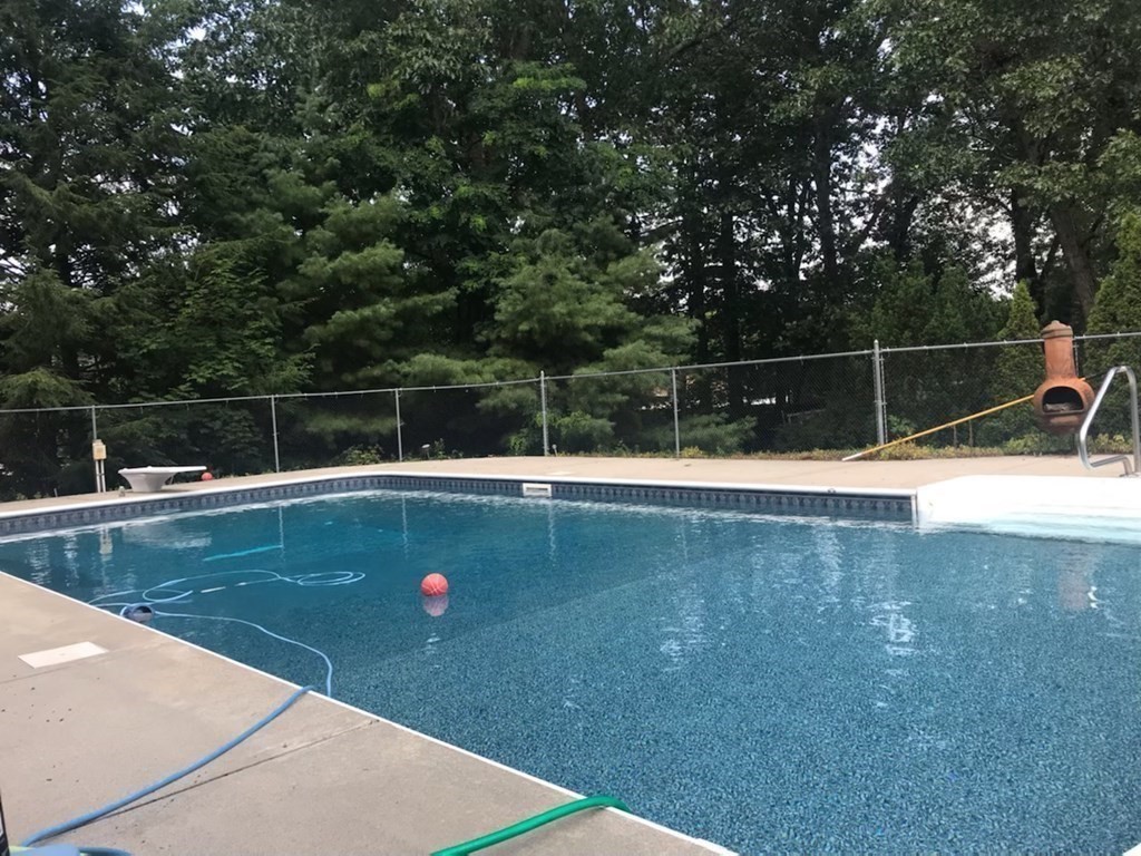 128 Birch Road Longmeadow, MA 01106 - Photo 9 of 39 a view of a swimming pool with a yard