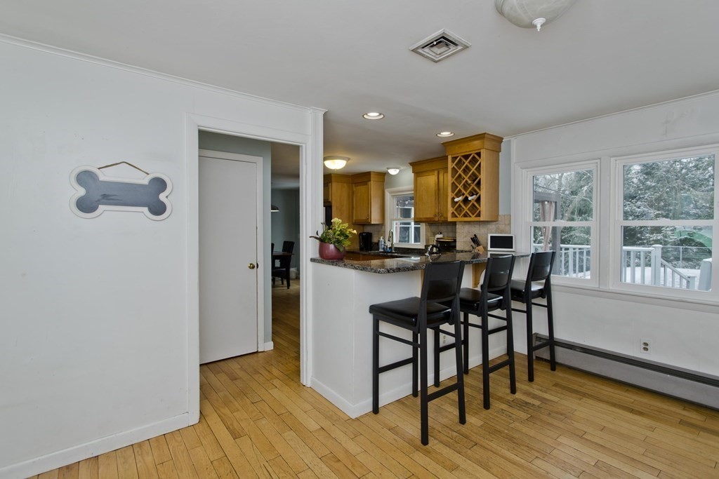 128 Birch Road Longmeadow, MA 01106 - Photo 10 of 39 a view of a dining room with furniture and wooden floor