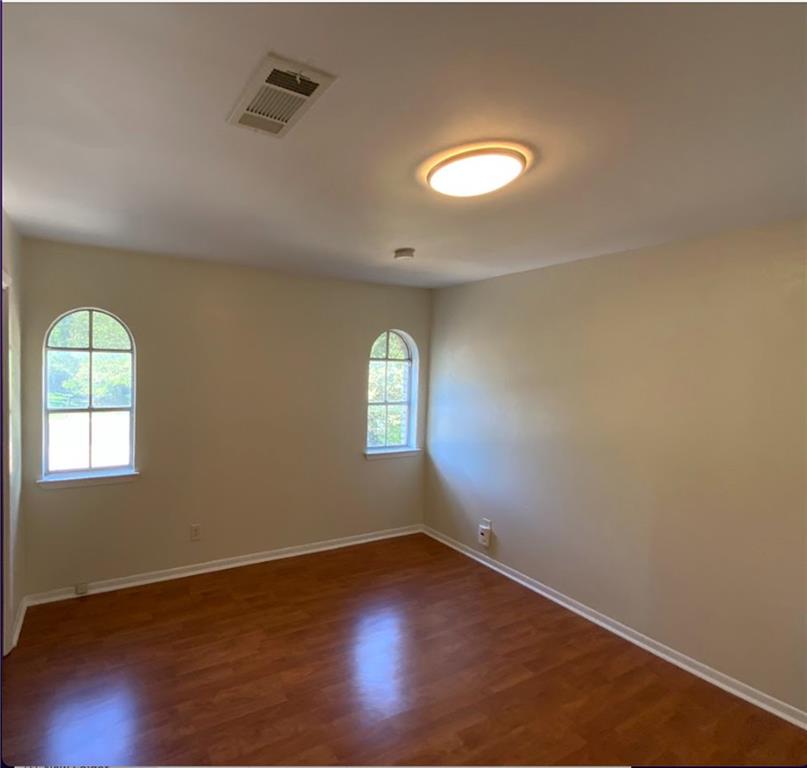 Undisclosed Address Austin, TX 78758 - Photo 16 of 21 an empty room with wooden floor and windows