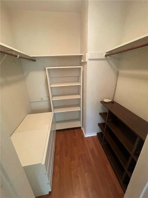Undisclosed Address Austin, TX 78758 - Photo 17 of 21 a room with a closet and wooden floor