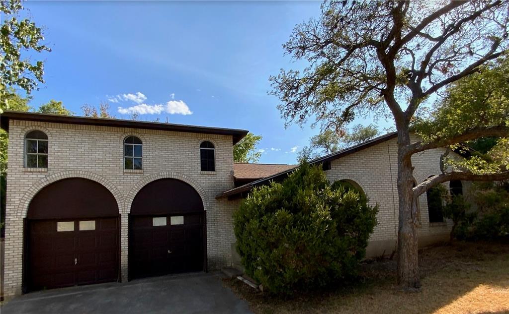 Undisclosed Address Austin, TX 78758 - Photo 18 of 21 a front view of a house with garden