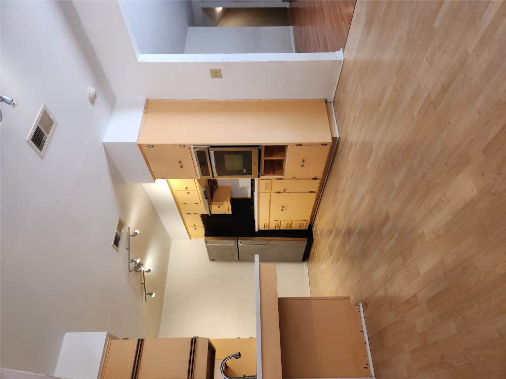 Undisclosed Address Austin, TX 78758 - Photo 5 of 21 a view of a kitchen with a sink and an oven