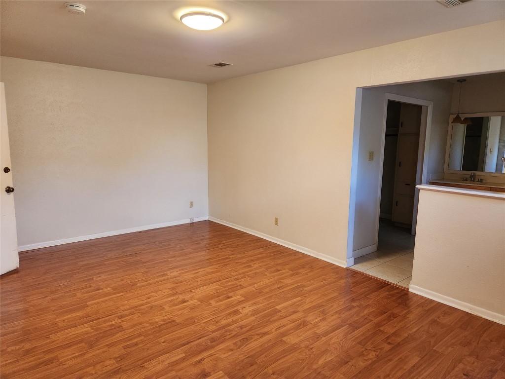 Undisclosed Address Austin, TX 78758 - Photo 9 of 21 a view of empty room with wooden floor