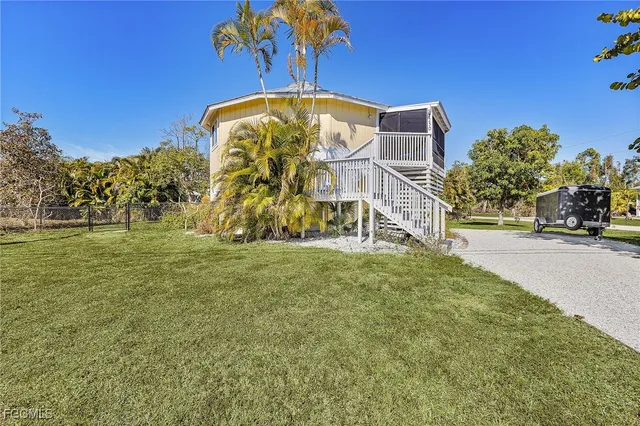 a view of a park with a building in the background
