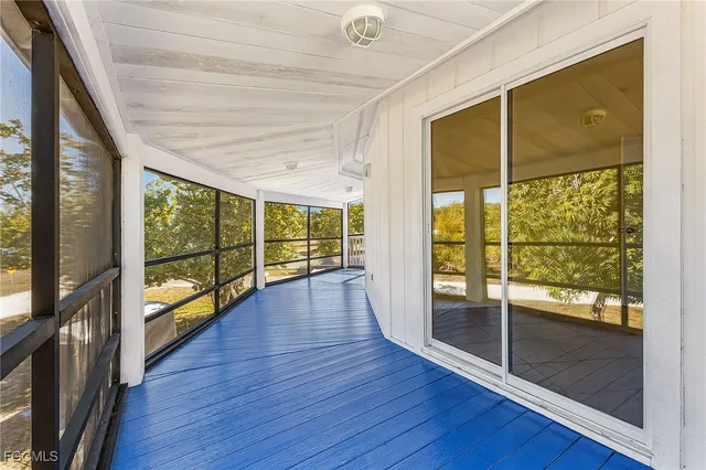 a view of an entryway with wooden floor and windows