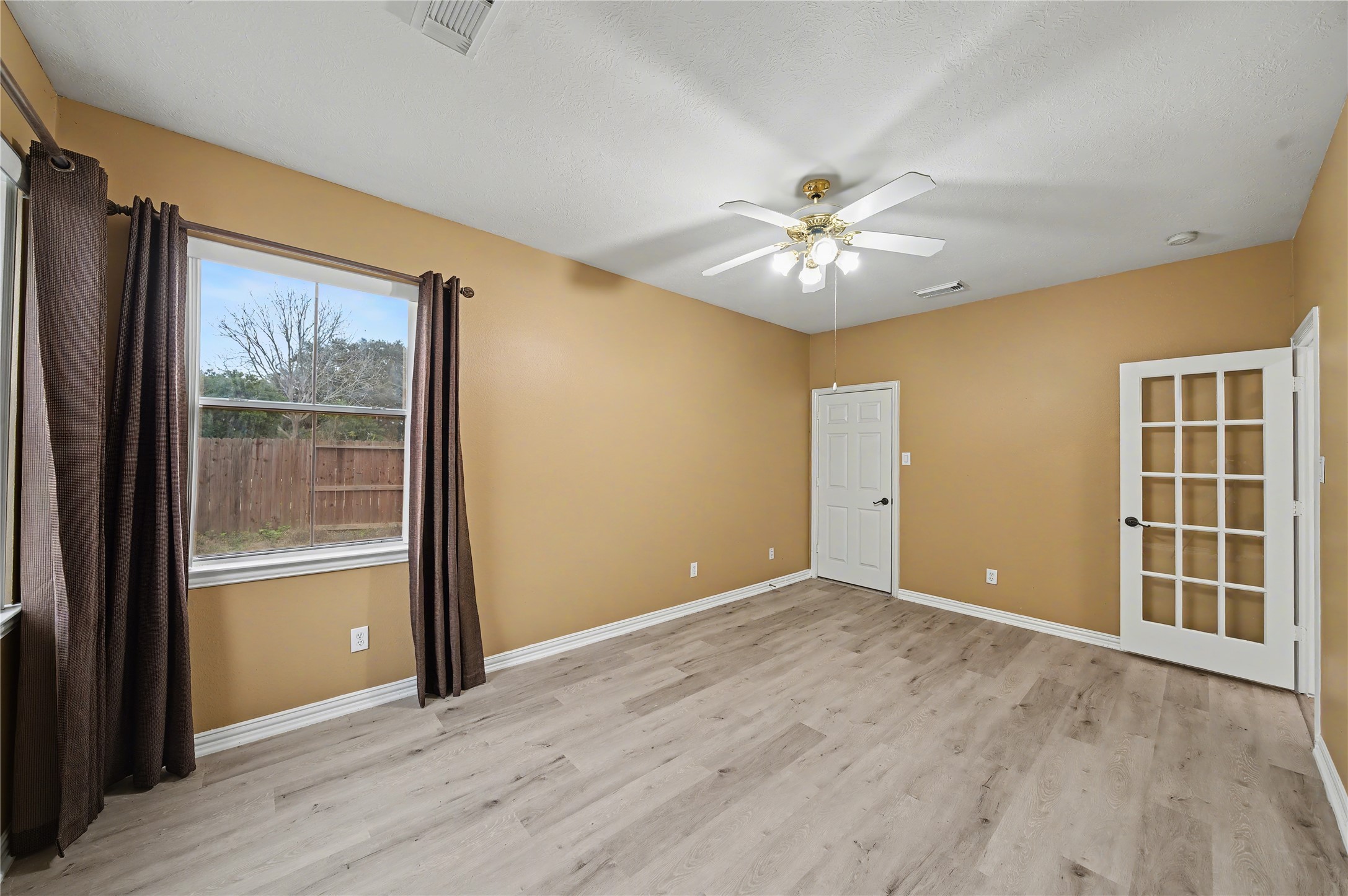 5403 Emerald Pointe Lane Sugar Land, TX 77479 - Photo 27 of 50 wooden floor in an empty room with a window
