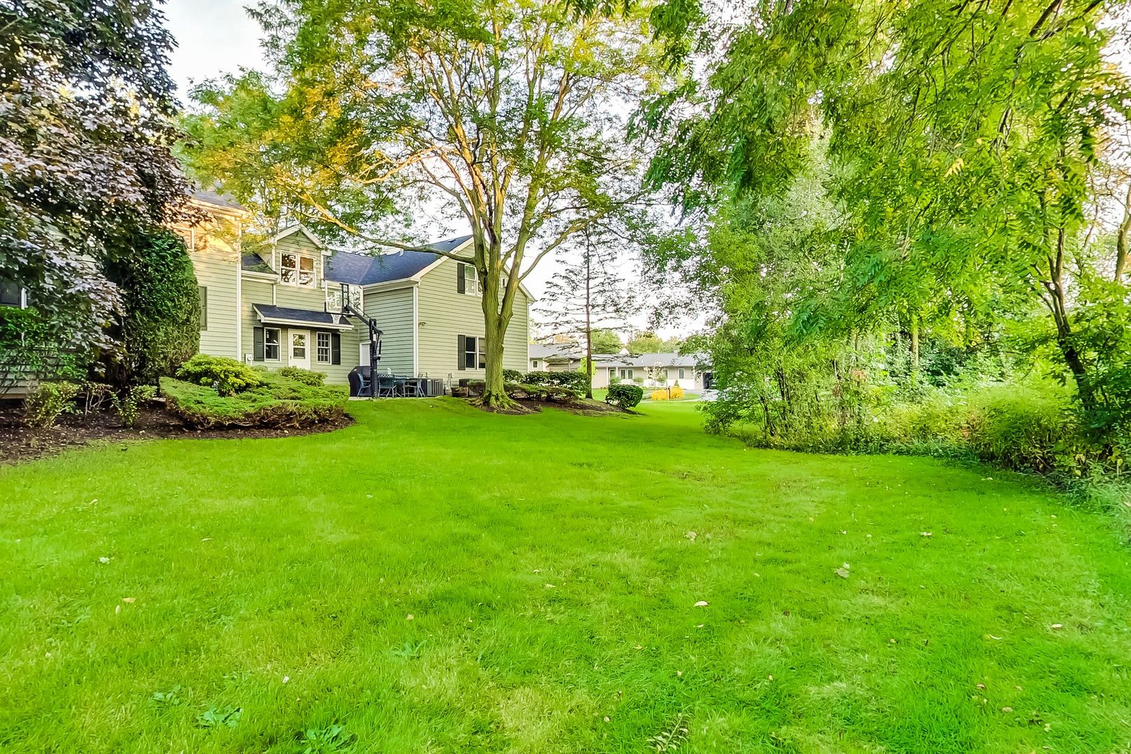 2131 Middlefork Road Northfield, IL 60093 - Photo 3 of 34 a front view of a house with a garden