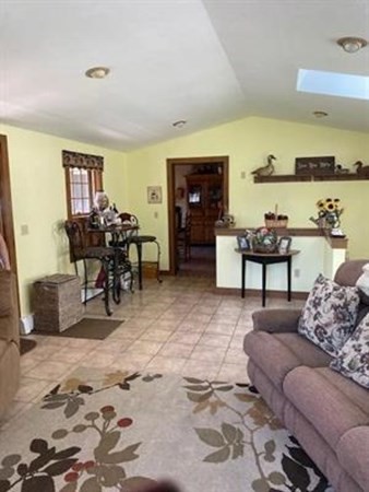 47 South Road Londonderry, NH 03053 - Photo 15 of 39 a living room with furniture and a flat screen tv