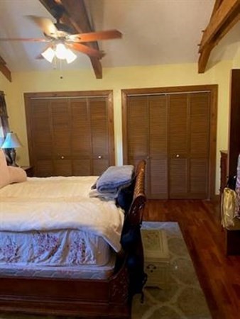 47 South Road Londonderry, NH 03053 - Photo 31 of 39 a bedroom with a bed and a chandelier