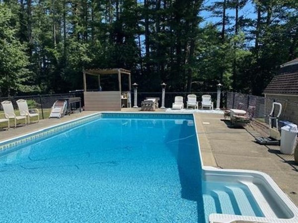 47 South Road Londonderry, NH 03053 - Photo 5 of 39 a view of a patio with swimming pool